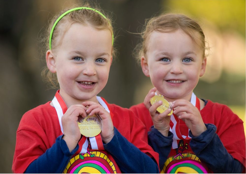 Twins with their medals at Boogie the Bridge, April 2026